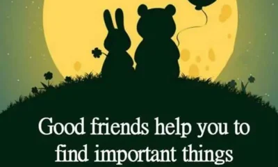 An inspirational quote by Doe Zantamata about good friends restoring smile, hope, and courage, set below silhouettes of a rabbit and bear holding a balloon against a full yellow moon. A heartwarming quote by Doe Zantamata celebrating how true friends help restore joy, hope, and strength during challenging times